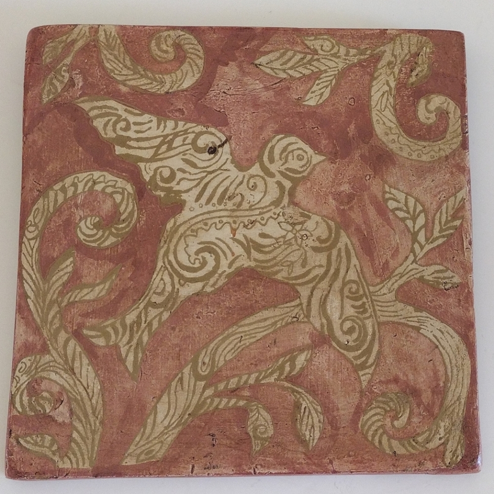Kate McRostie hand-painted tile wall hanging with bird in bole